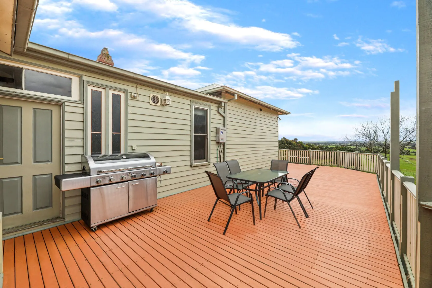 BBQ and outdoor deck seating area