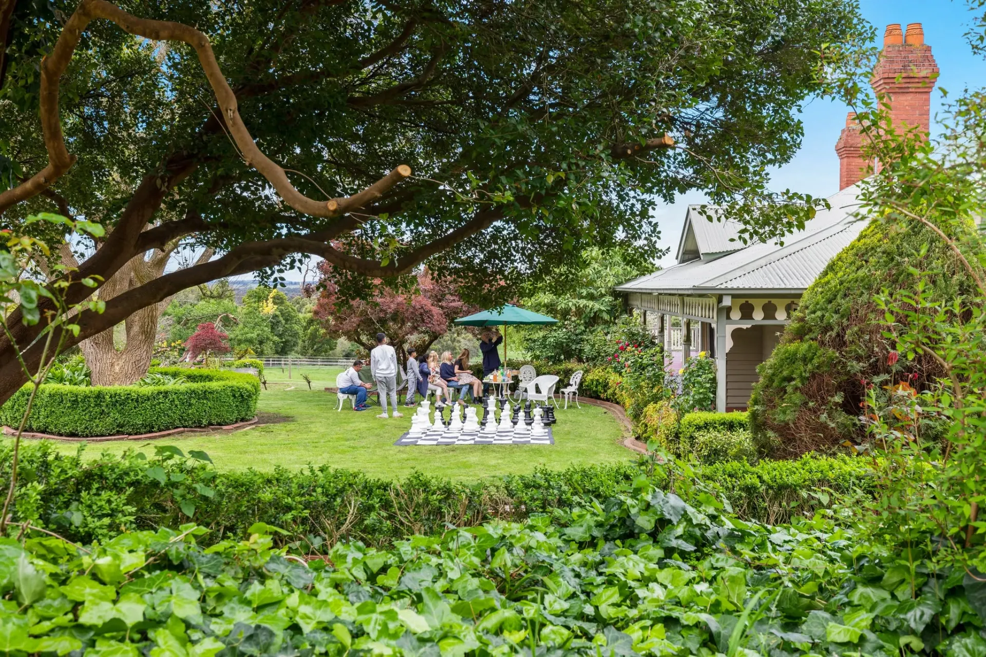 Front garden and house facade with lawn games set up